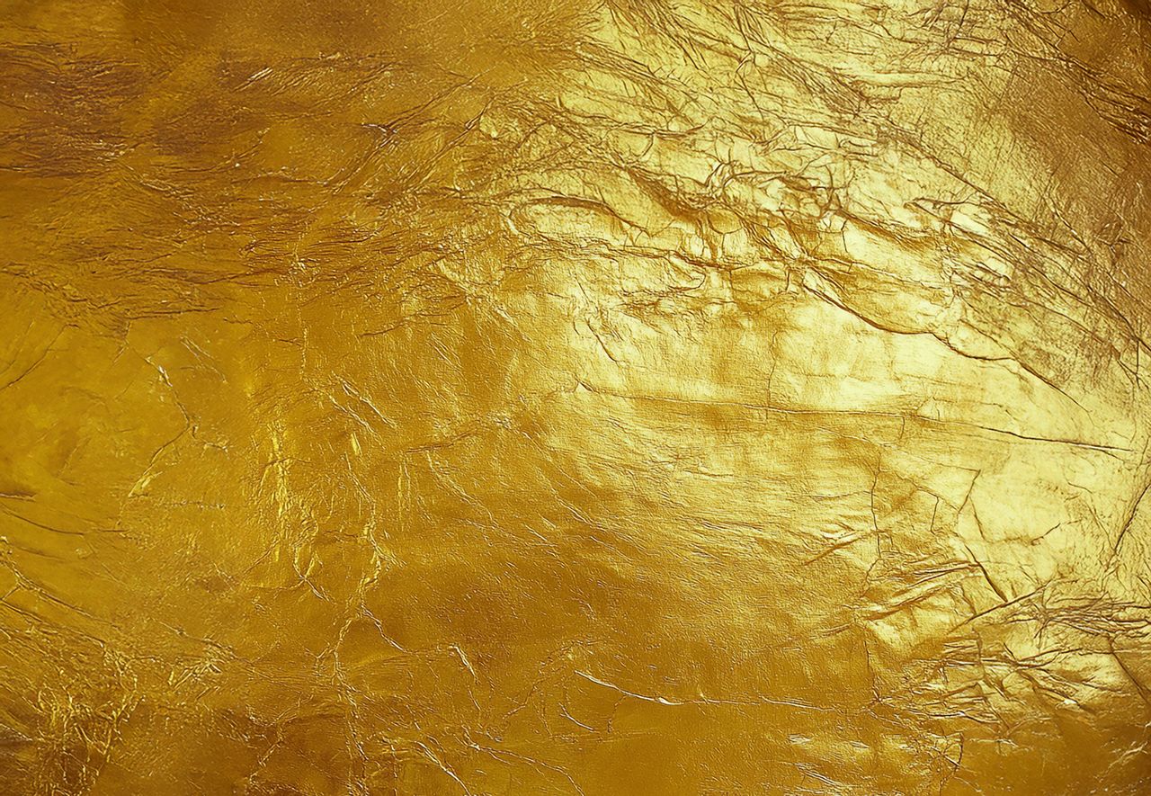 Luxurious gold leaf texture ideal for elegant and creative backdrops.
